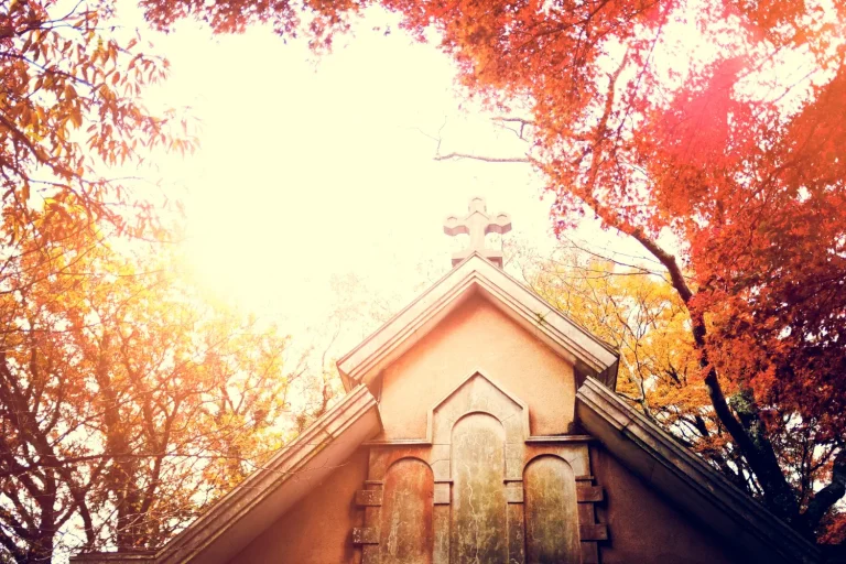 A beautiful church in a park-like field